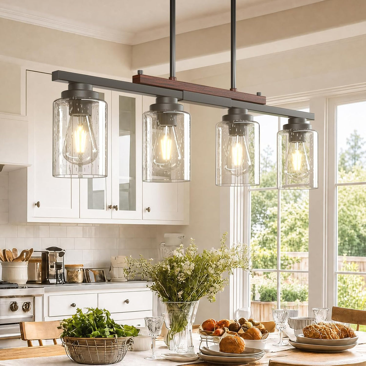 Seeded-glass pendant fixture hung over a set breakfast table with vase of flowers, plates, bowls and a sunlit kitchen