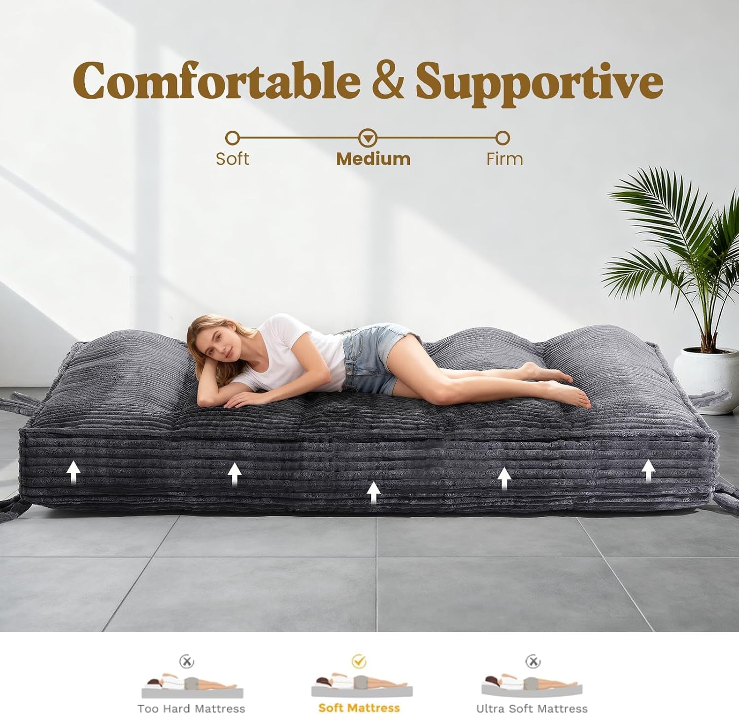Low-angle view of the grey futon mattress lying flat showing medium support profile