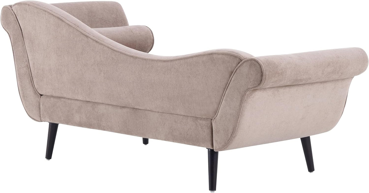 Three-quarter rear view of a light brown velvet chaise with scrolled arms and tapered black legs.