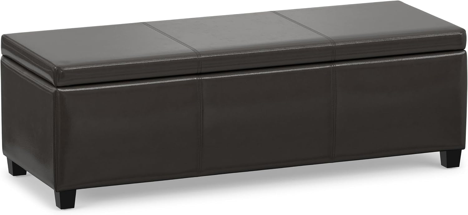 Dark slate-grey rectangular storage ottoman with stitched top panels and short black tapered legs.
