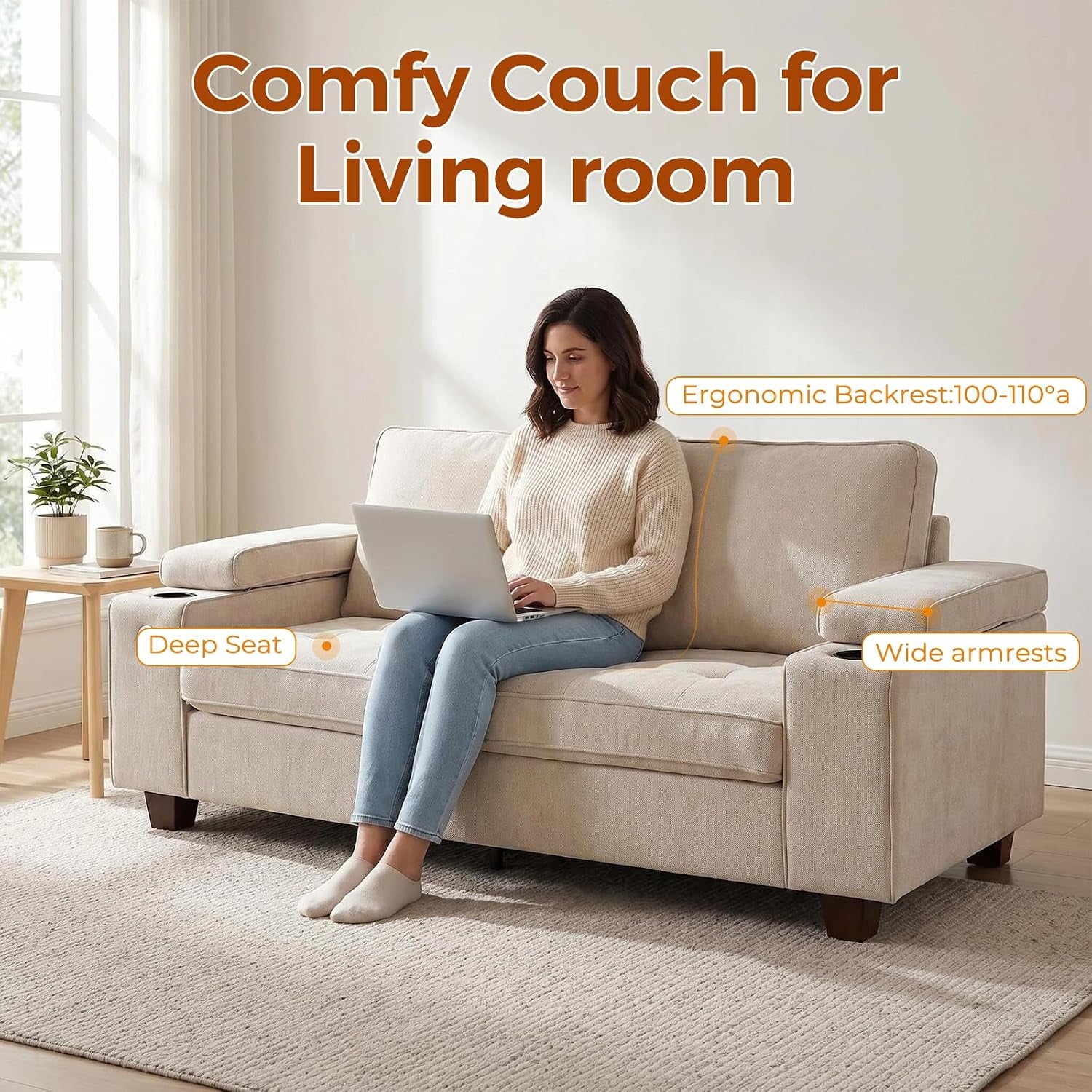 Front view of a beige loveseat in a bright living room with a woman using a laptop on the center seat.