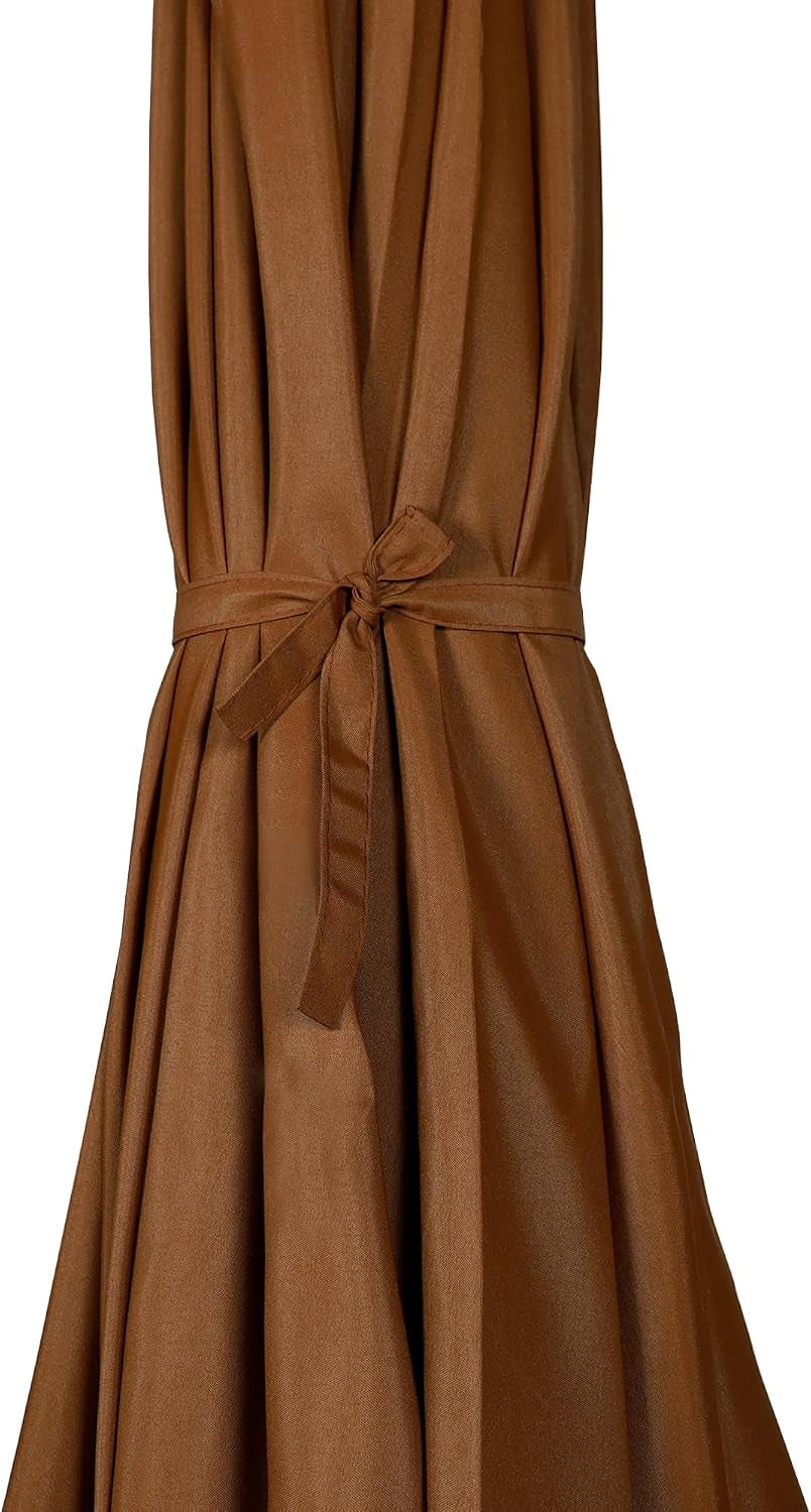 Close-up of brown umbrella canopy tied closed with a fabric strap