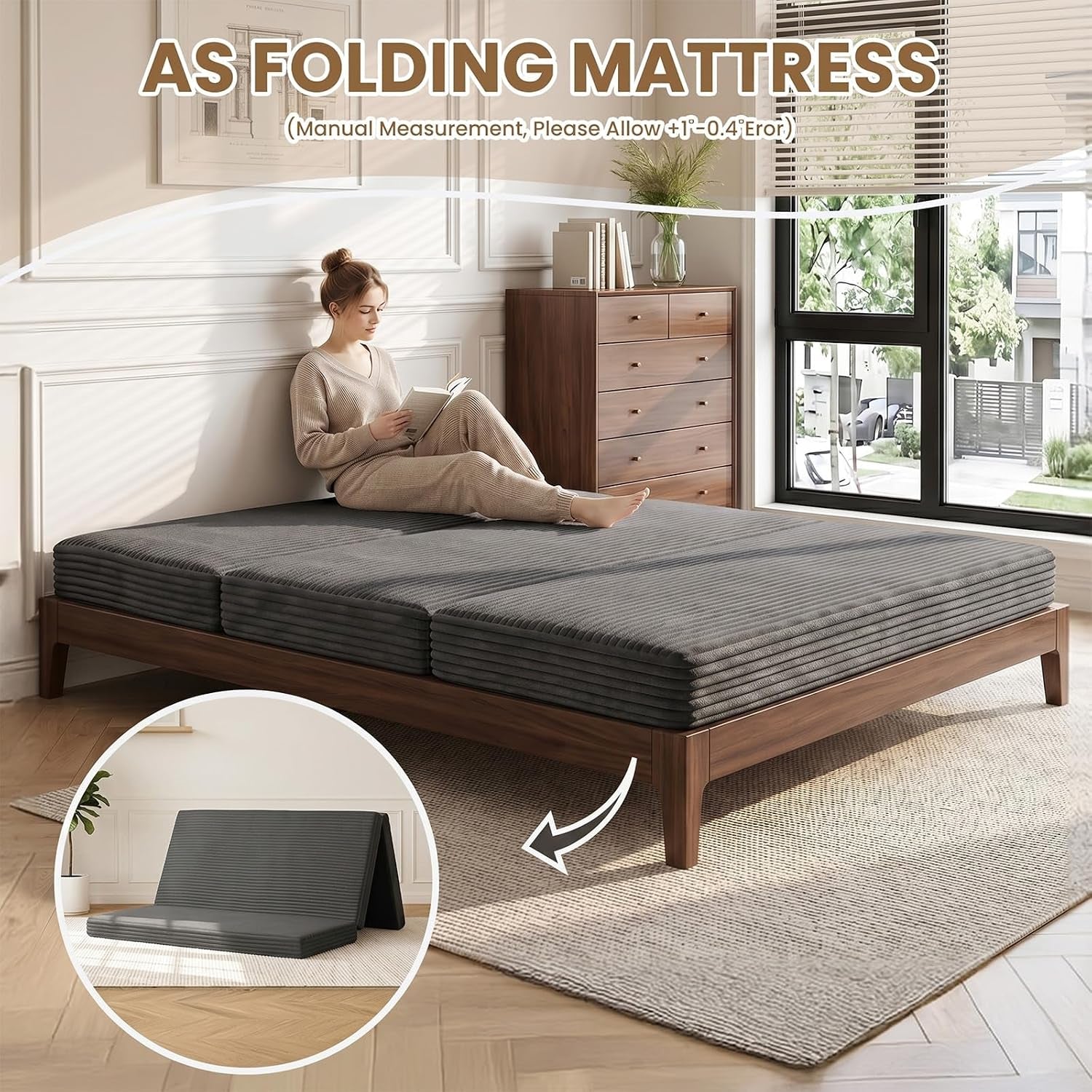 Grey ribbed folding mattress laid flat on a bed frame with a woman reading while seated on it