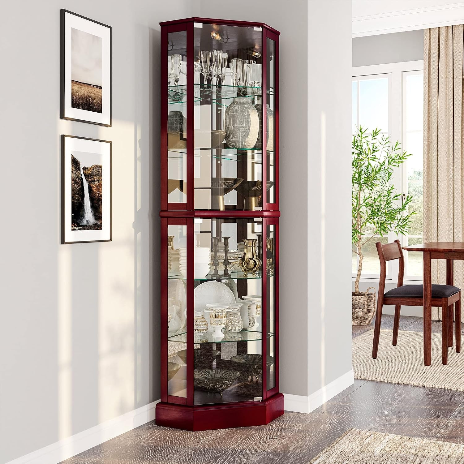 Red-finished corner display cabinet filled with dishes and glassware beside dining area.
