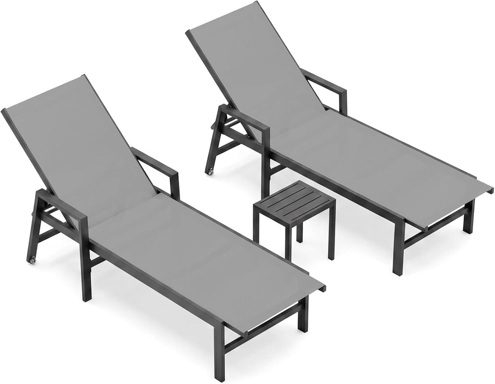 Two gray chaise lounges with a small slatted side table placed between them