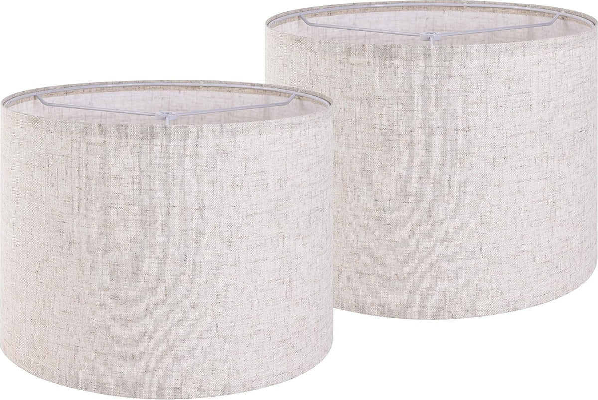 Two off-white linen drum lampshades shown side by side, front and slightly behind view.
