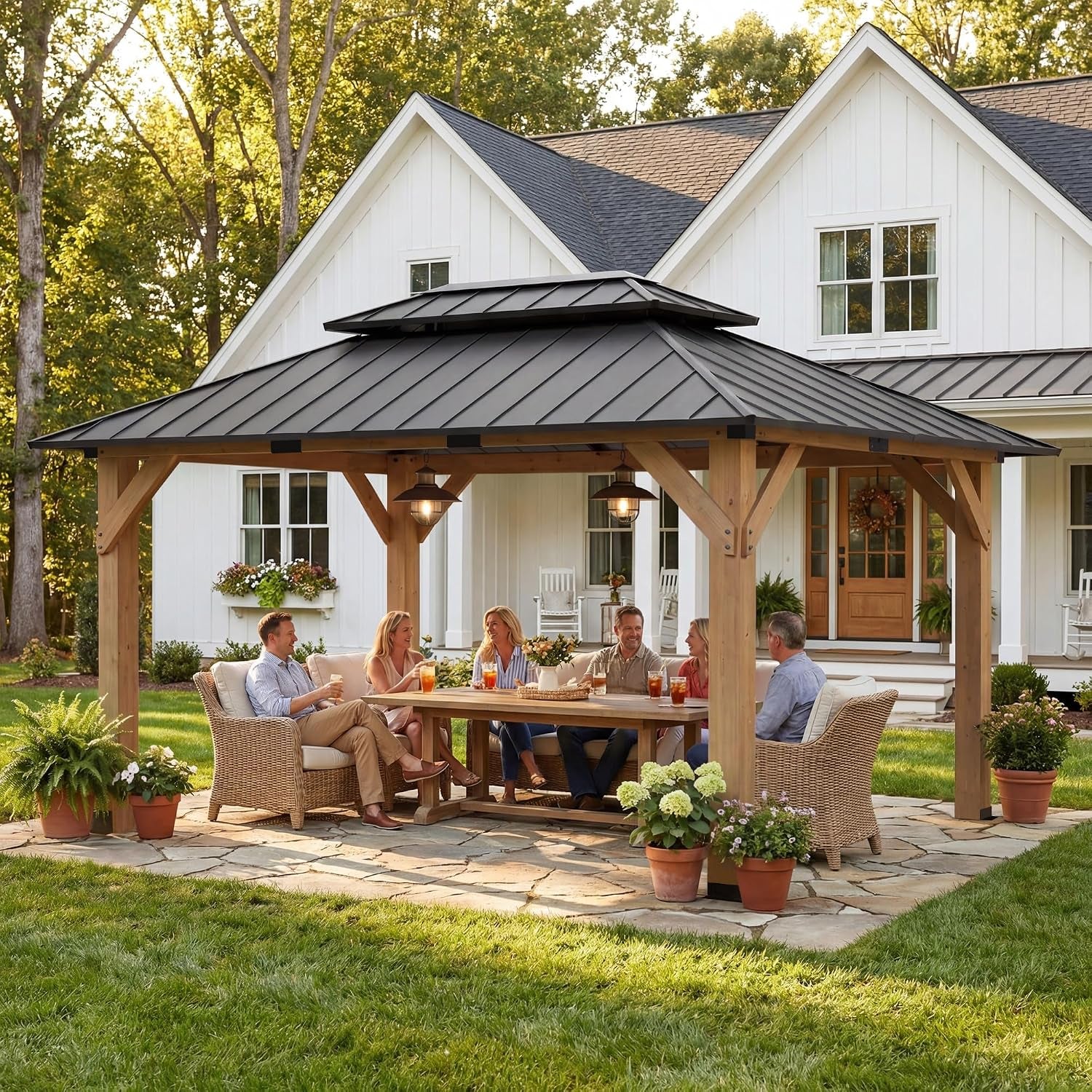 Solid wood gazebo with dark metal roof over outdoor dining scene on a stone patio in a backyard