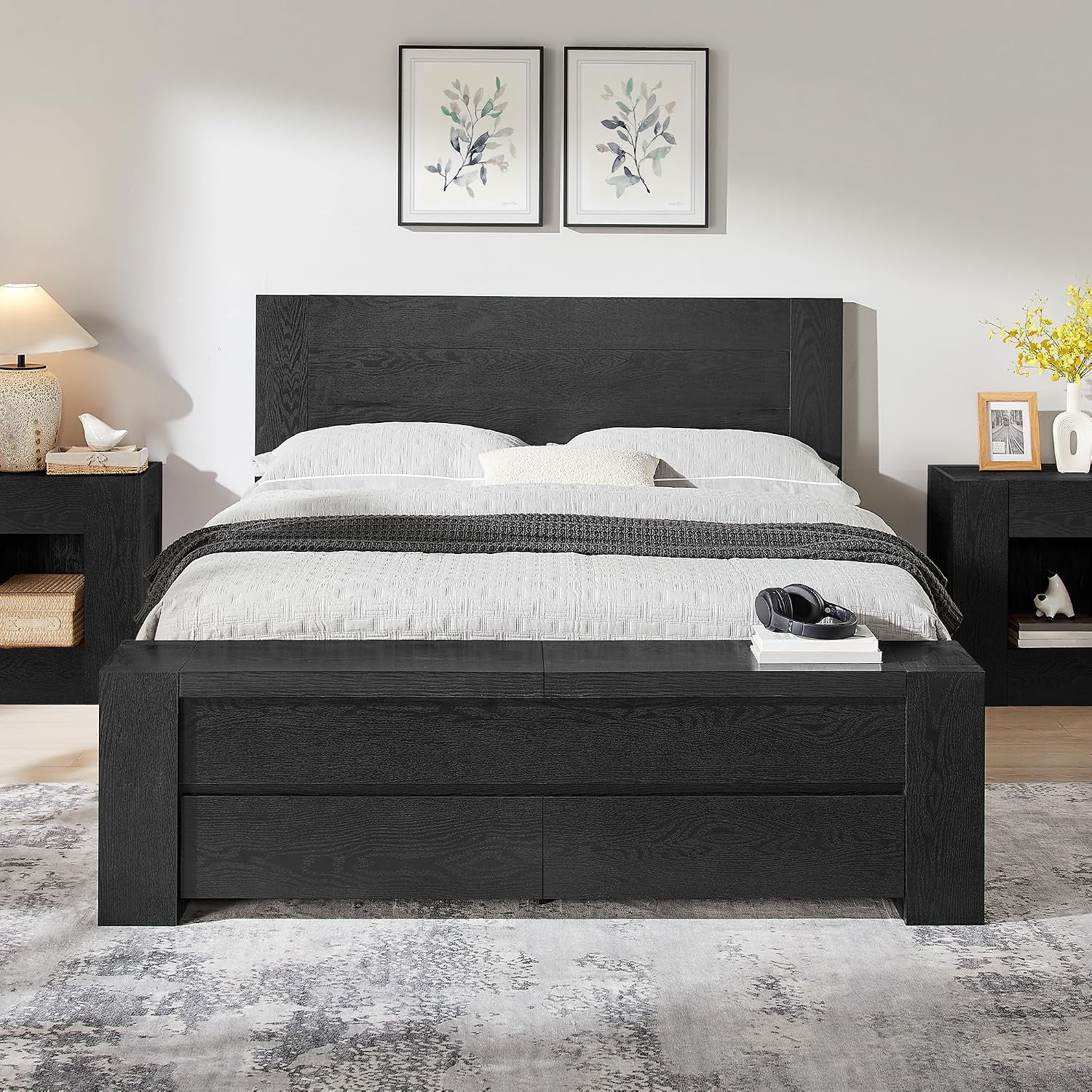 Front view of black platform bed showing slim headboard and integrated footboard storage