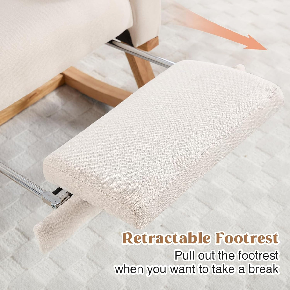 Close-up of the beige padded retractable footrest and metal support bars over a textured rug.
