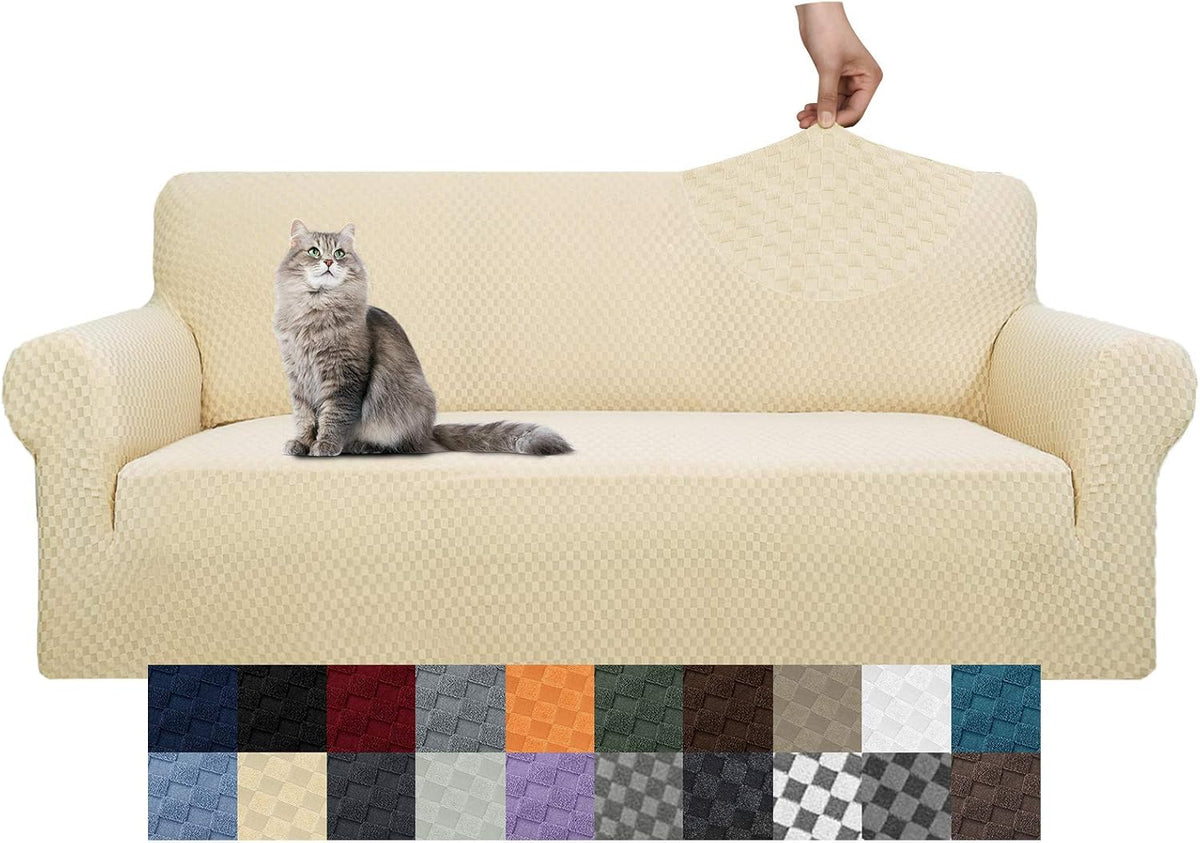 Three-seat cream stretch slipcover on a sofa with a gray long-haired cat on the cushion and a hand lifting the back corner