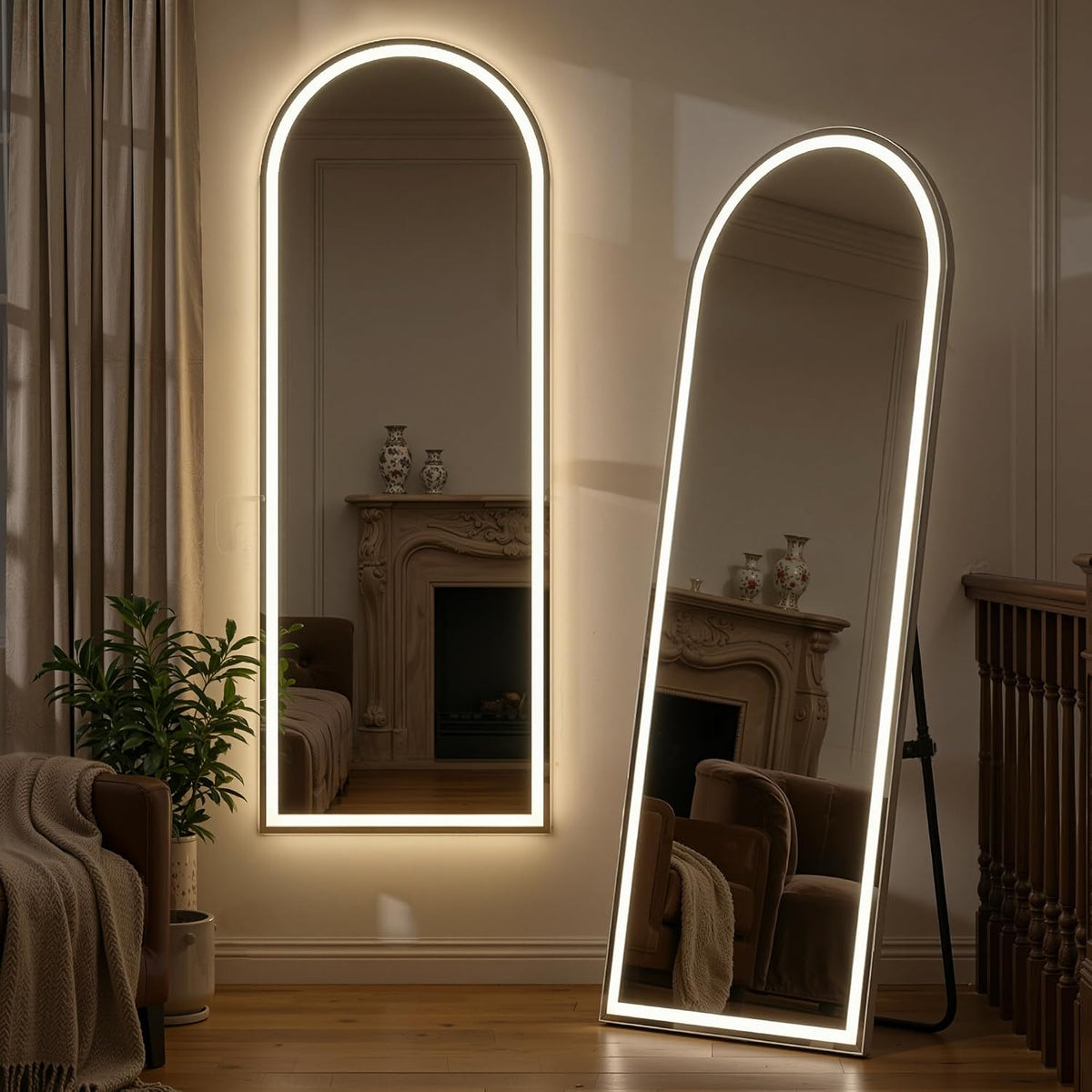 cozy living corner with a wall-mounted arched LED mirror and a leaning arched floor mirror illuminated