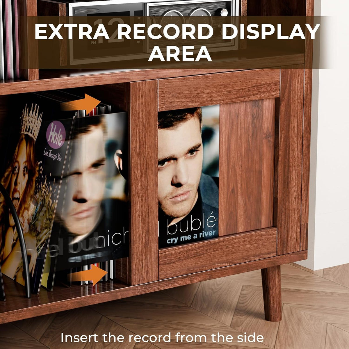 Close-up of sliding door and side-insert record display showing vinyl being inserted into a lower cubby