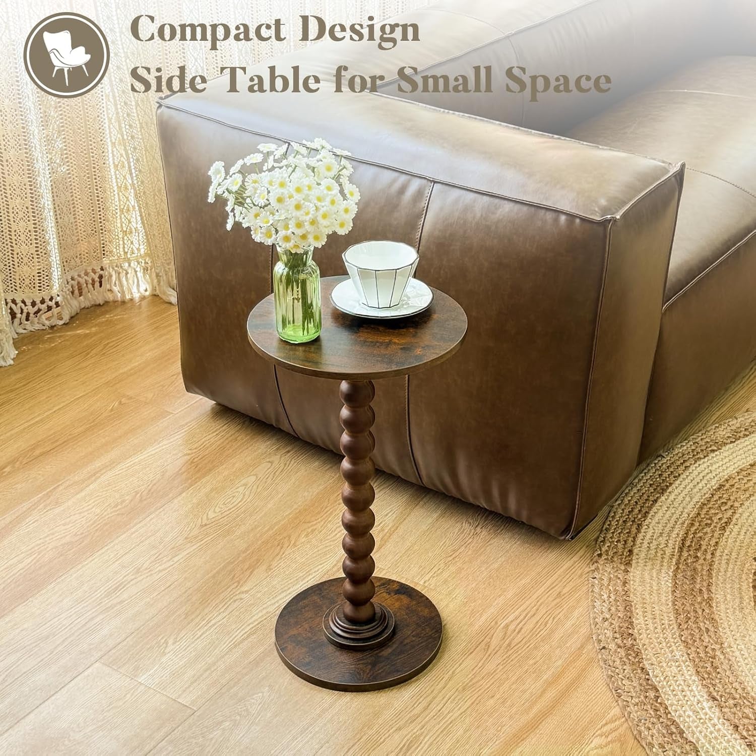 Round side table placed beside sofa used as a compact side table with a small vase and cup