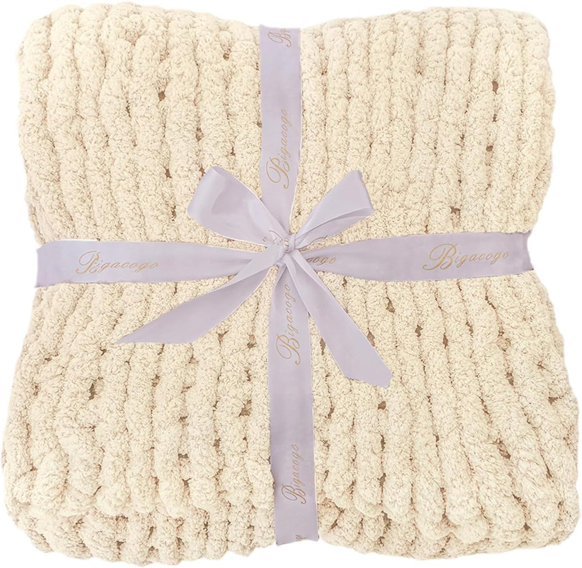 Folded beige chunky knit throw tied with a pale ribbon, photographed from above.