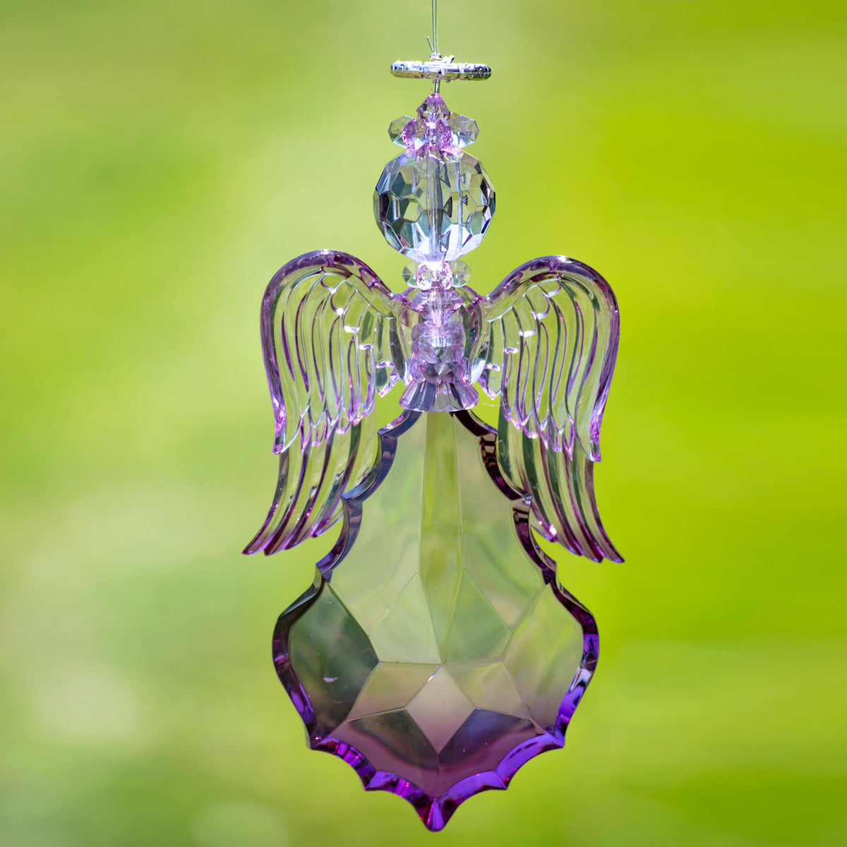 Purple angel ornament with curved wings hanging beneath a faceted round head.