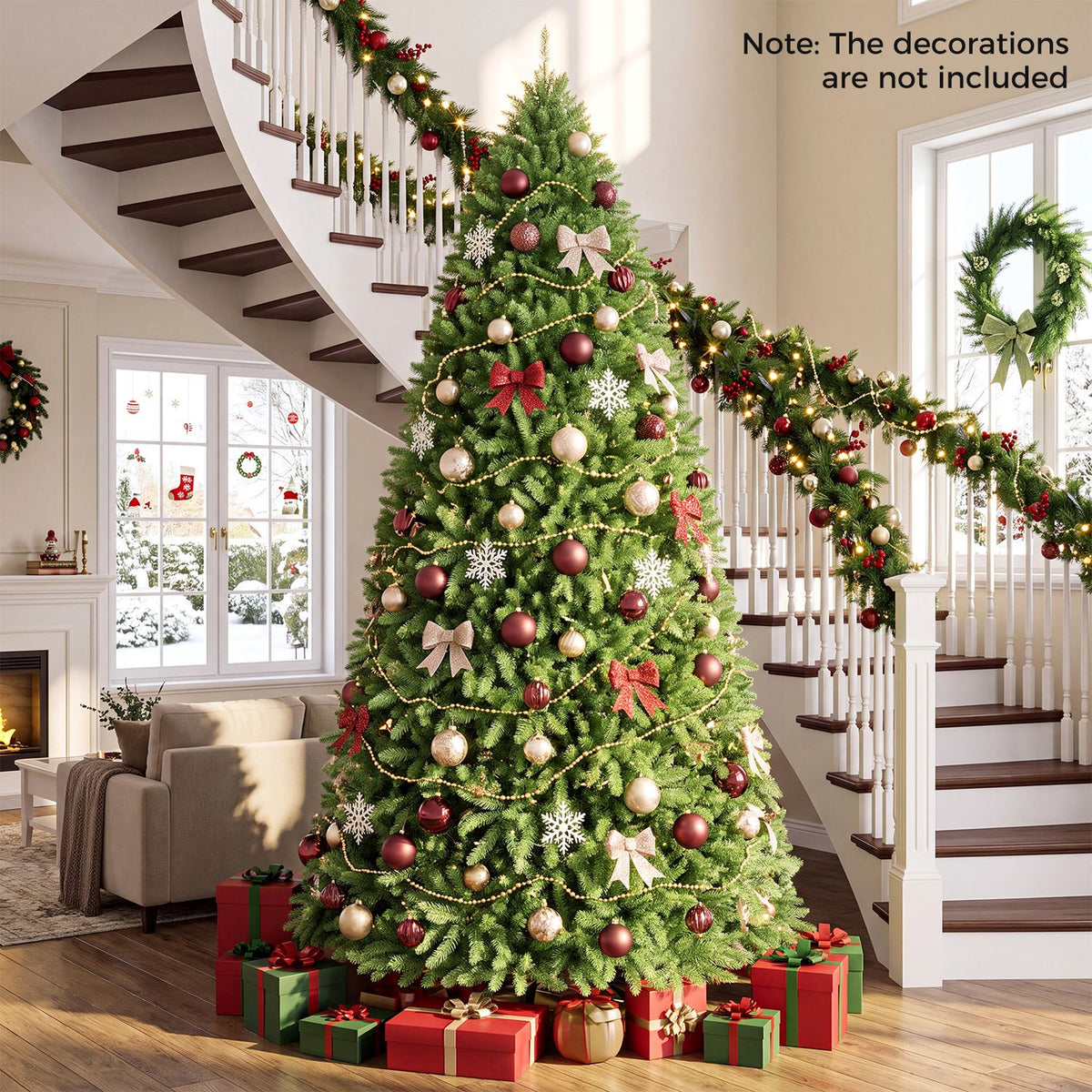 A decorated Christmas tree surrounded by gifts in a living room with a staircase and garland.