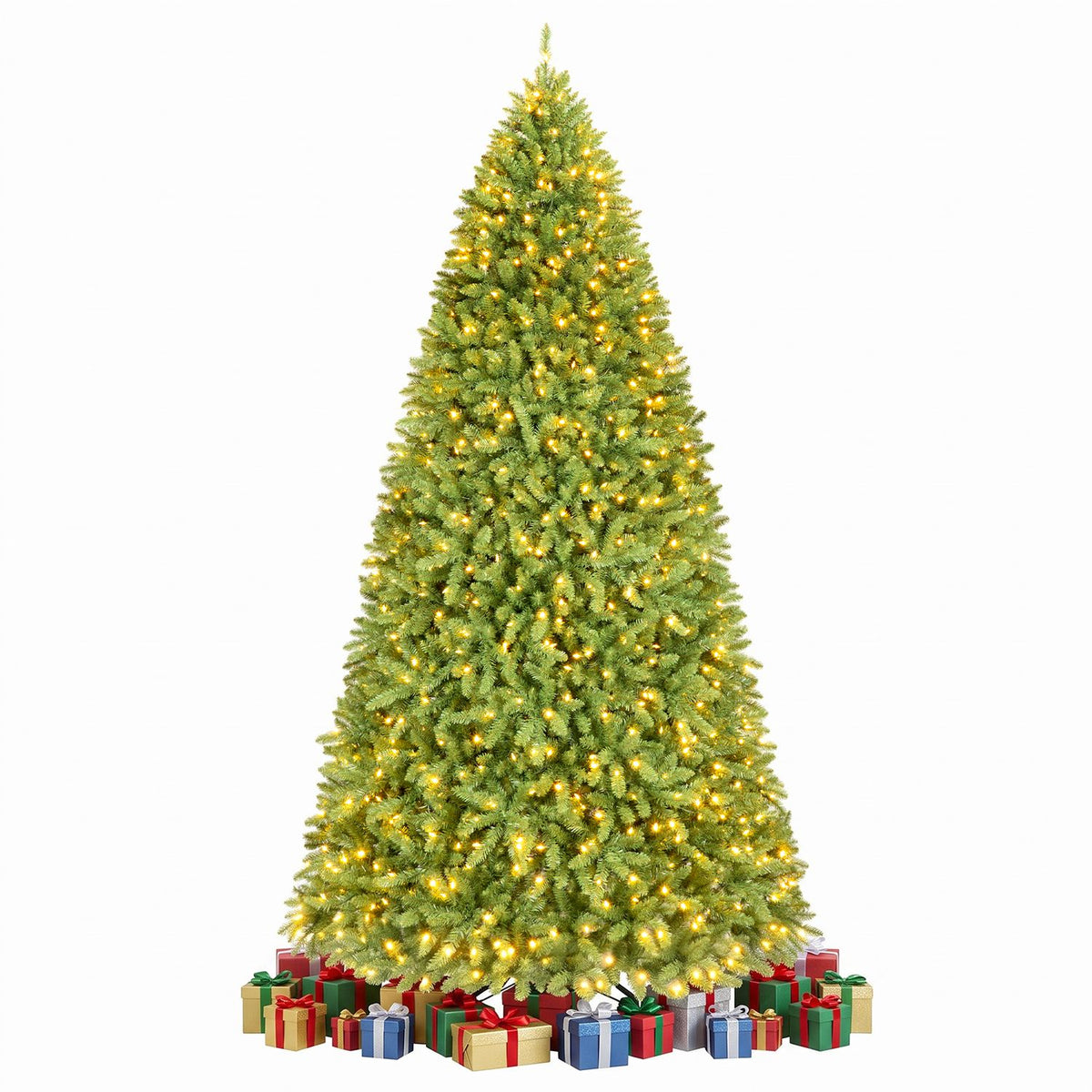 Green artificial Christmas tree glowing with warm lights, with wrapped presents arranged around its base.