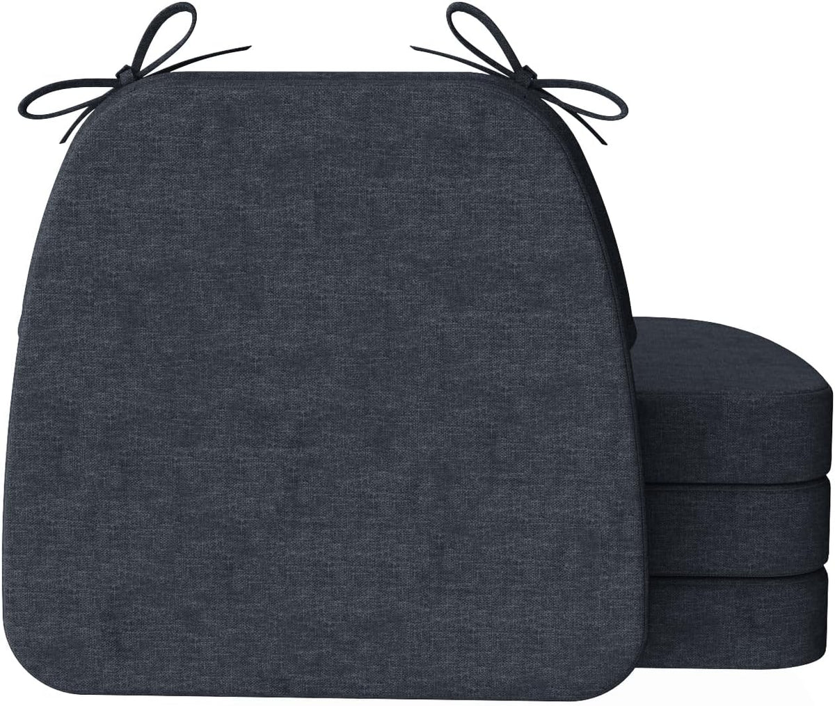 Front-facing dark charcoal D-shaped cushion showing tied loops at top and three cushions stacked to the right