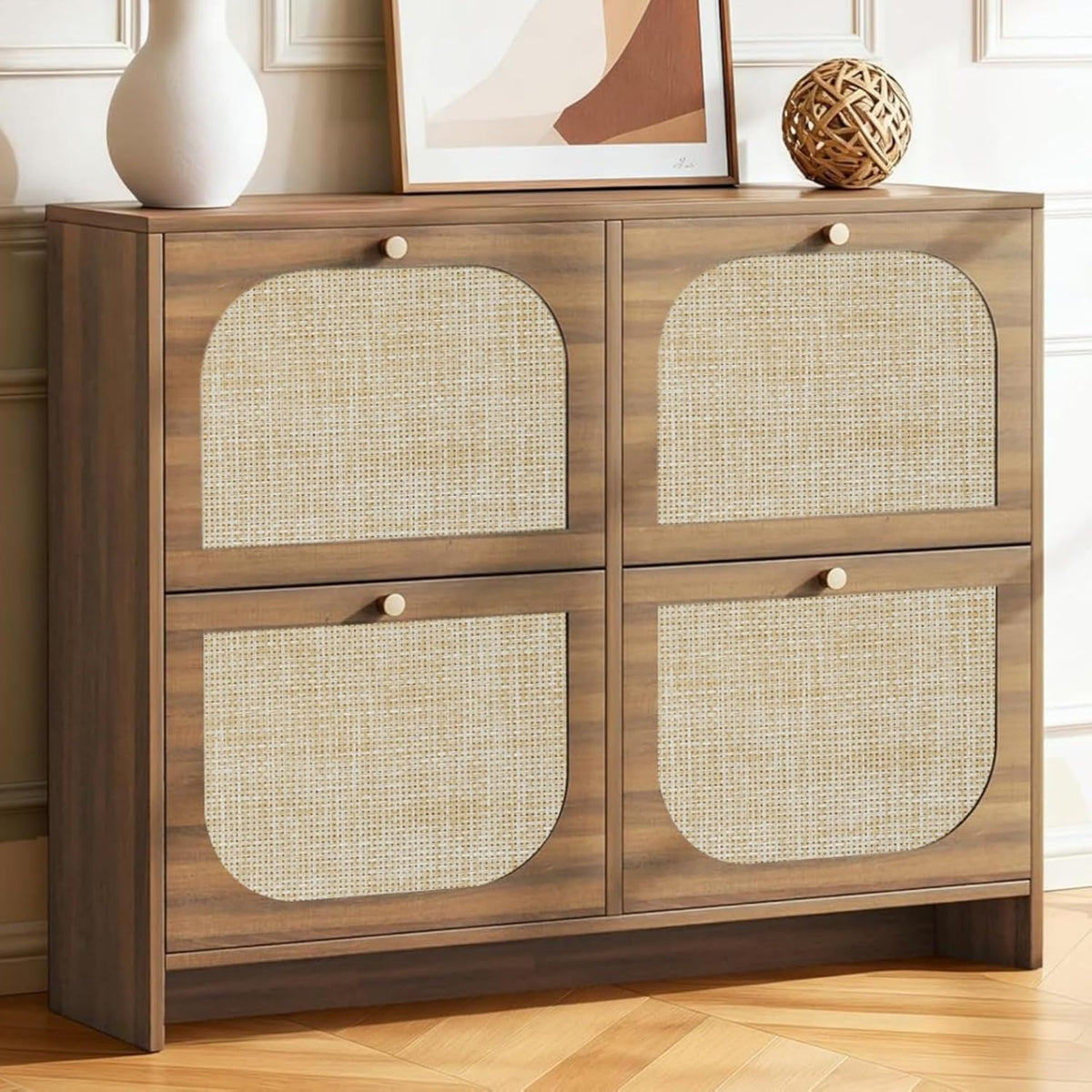 Square, double-wide cabinet with four rattan-front flip drawers against a paneled wall