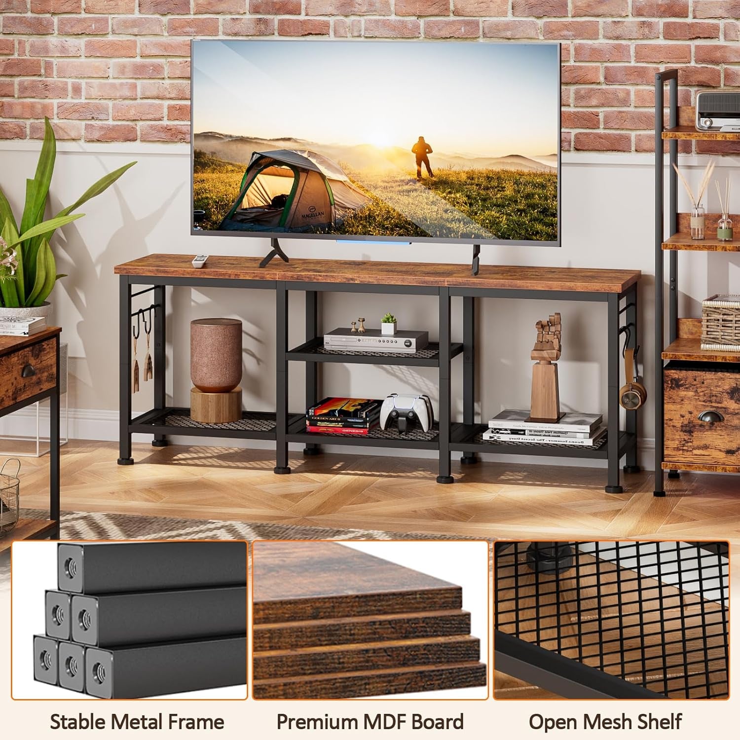 Front view of TV console against wall with TV on top and decorative objects on lower mesh shelves