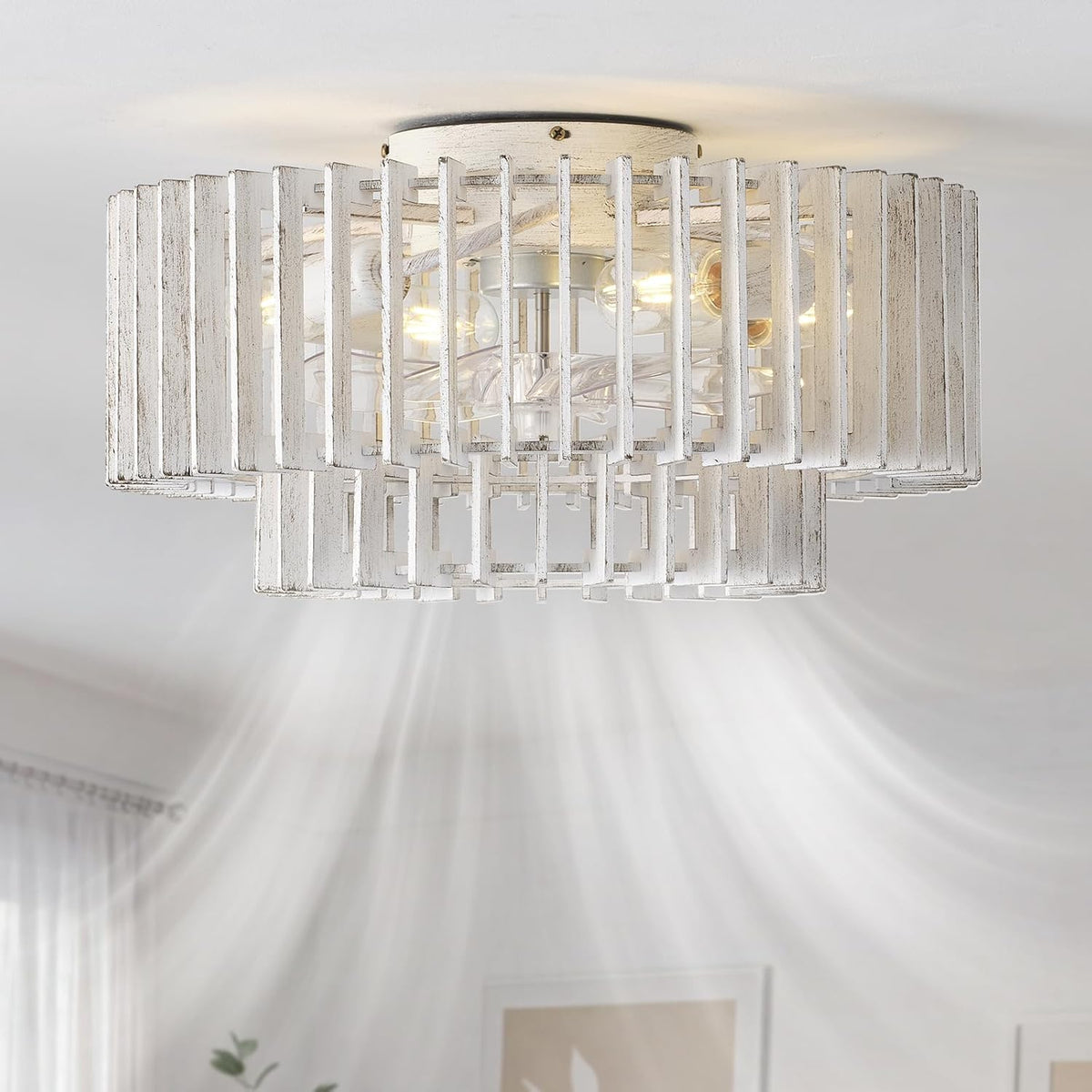 Ceiling-mounted white distressed wood caged fan lit, casting radial light beams across a bright room.