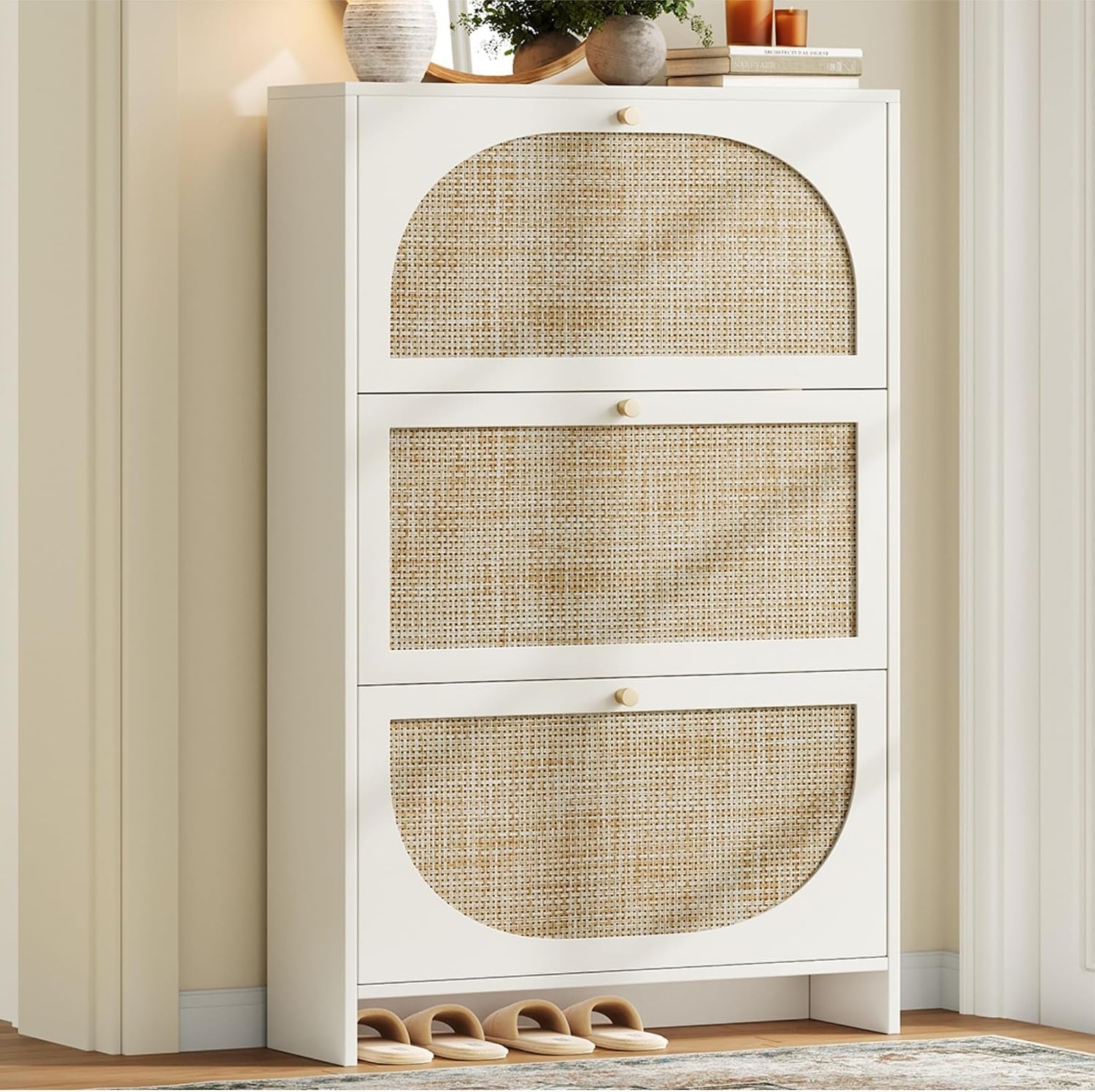 Tall white cabinet with three rattan-front flip drawers standing against a wall.