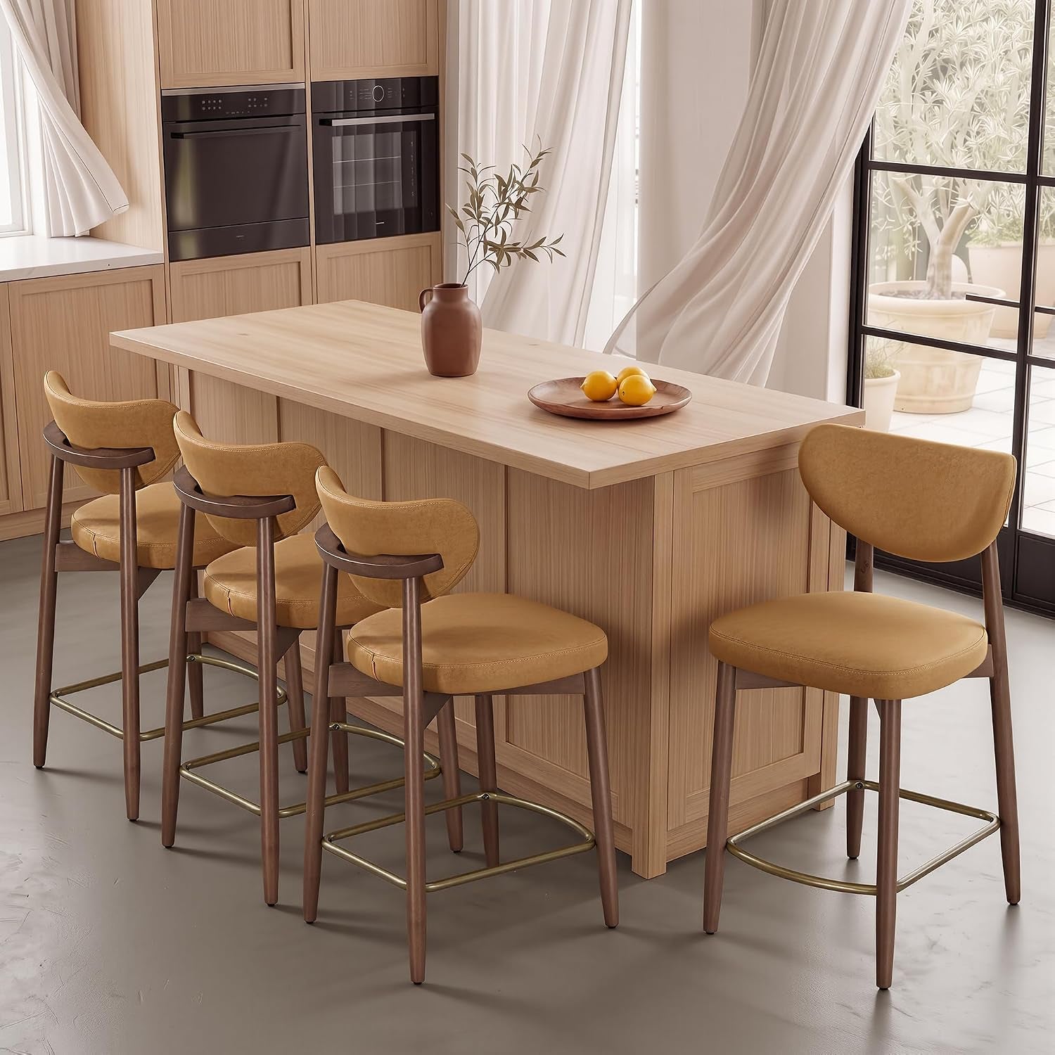 Four mustard-colored bar stools arranged at a light wood kitchen island