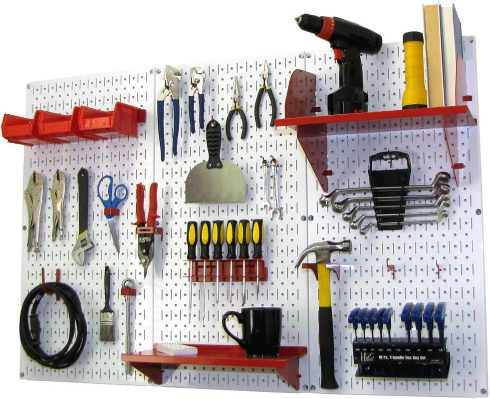 White metal pegboard with red shelves and holders displaying hand tools, a mug and a hammer.