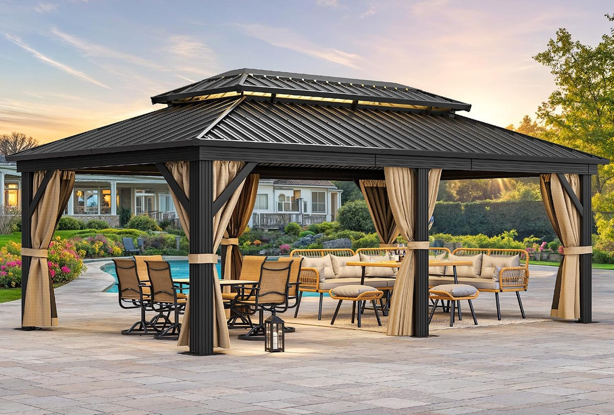Dark gray hardtop gazebo with beige curtains tied to square posts over outdoor dining and lounge set by a pool at sunset.
