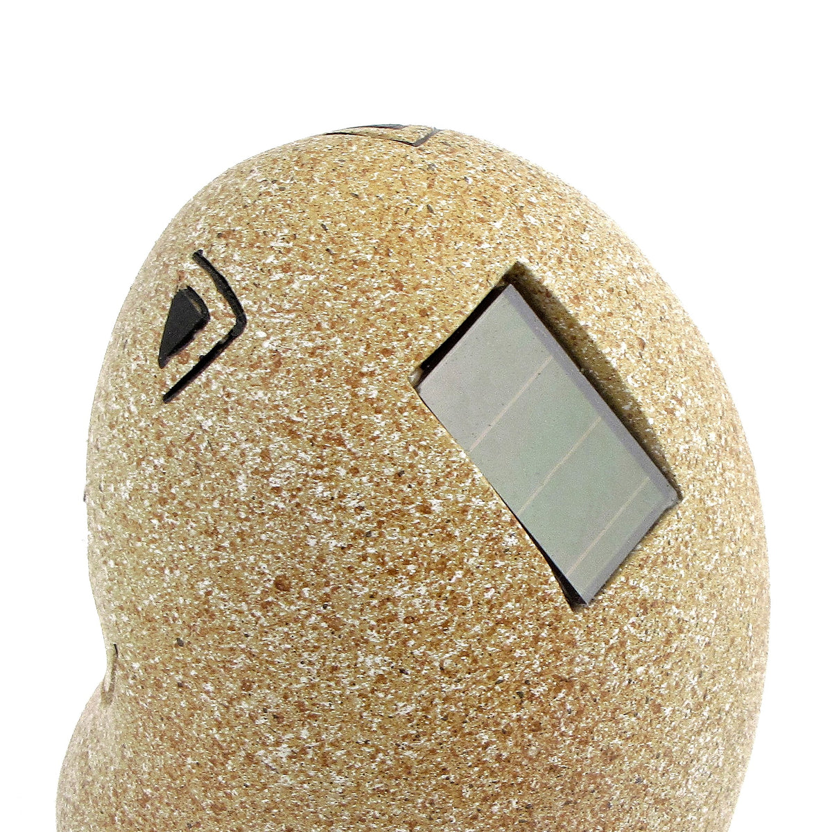 Rear of a speckled cat ornament with a rectangular solar panel set into its back.