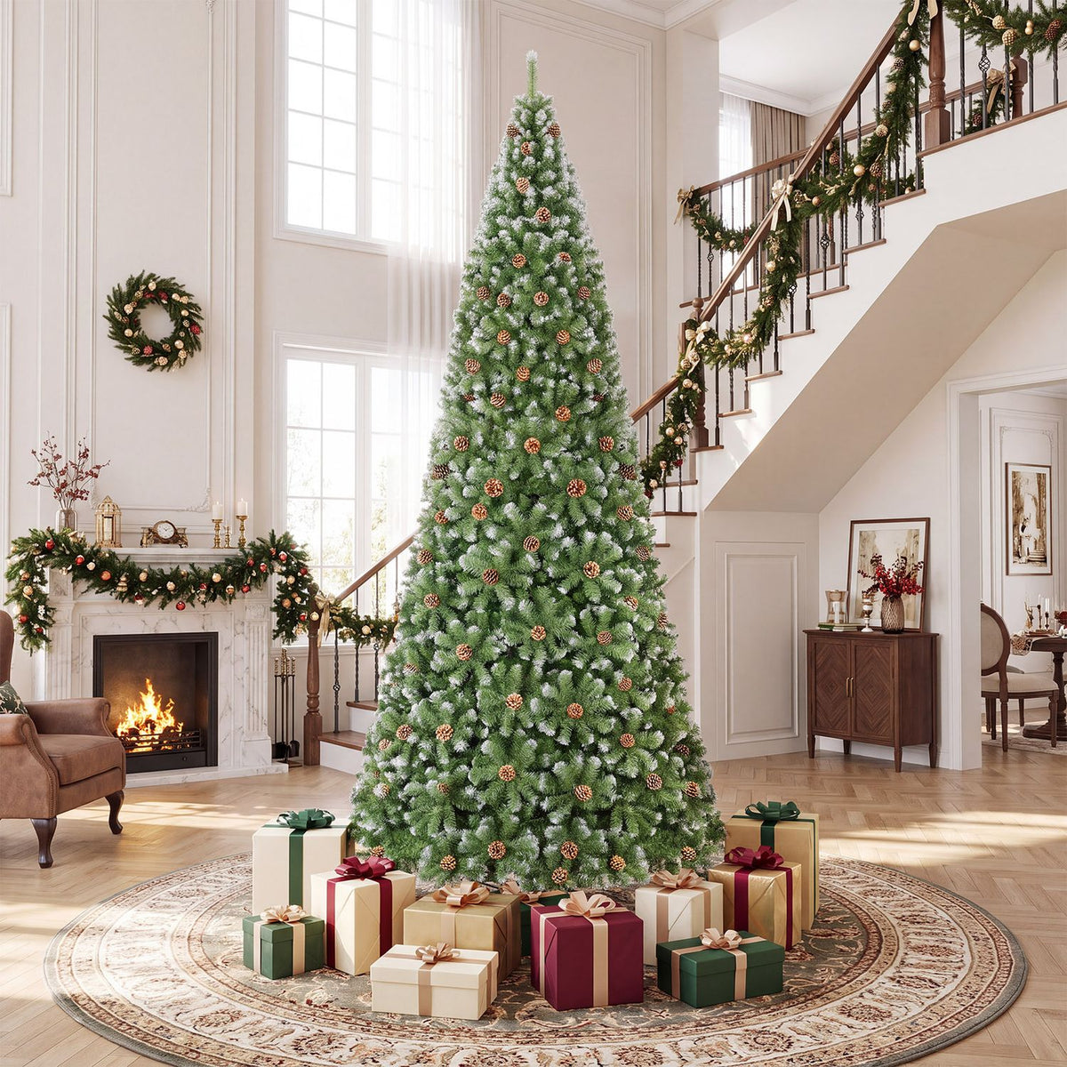 Decorated green Christmas tree surrounded by presents in a bright foyer beside a fireplace and staircase.