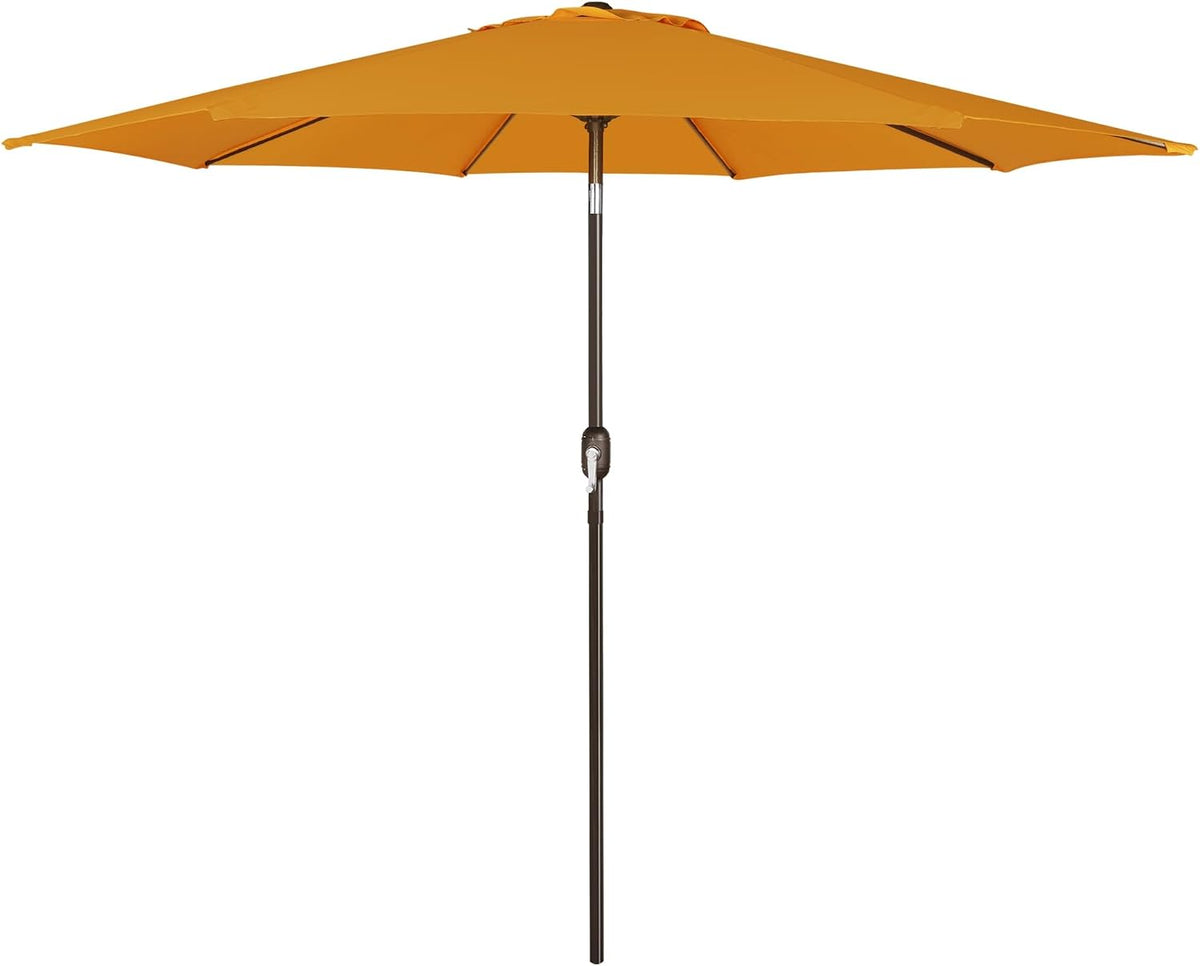 Yellow-gold patio umbrella open with dark pole and visible ribs and crank housing.