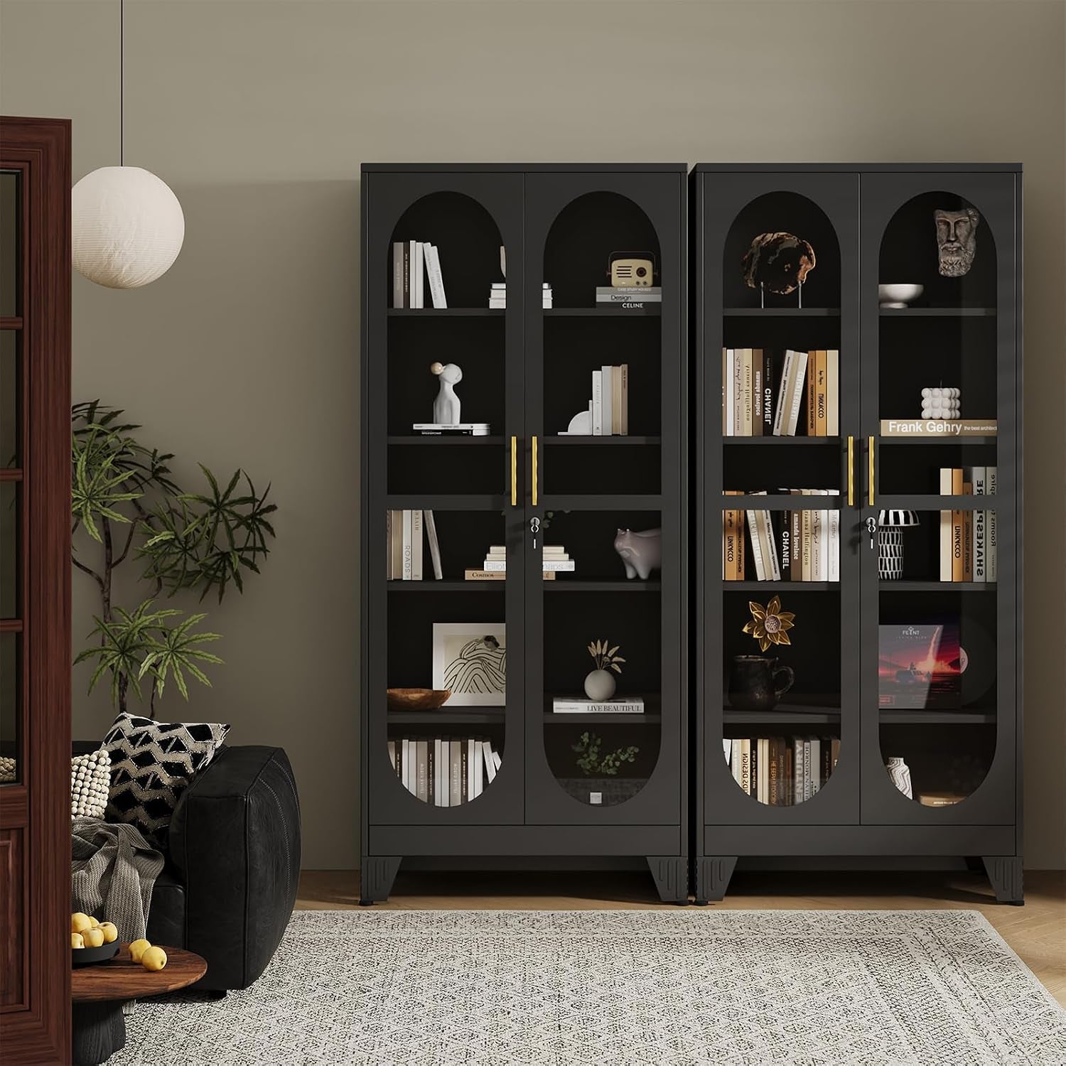 Two black steel display cabinets styled in a living room, front view with gold handles and decorative shelves
