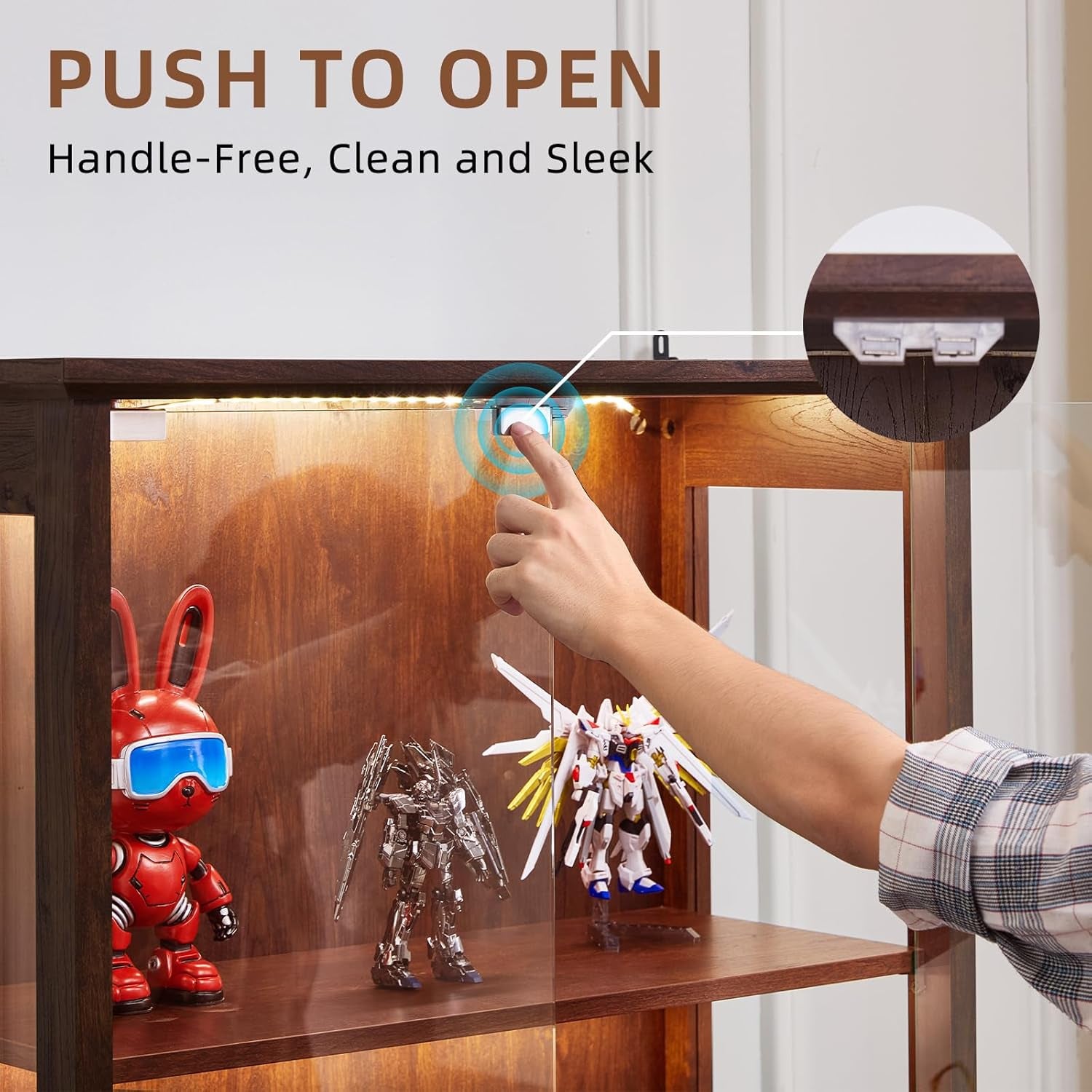 Close-up of a finger pressing the push-to-open button at the top inside the cabinet with collectibles on the shelf