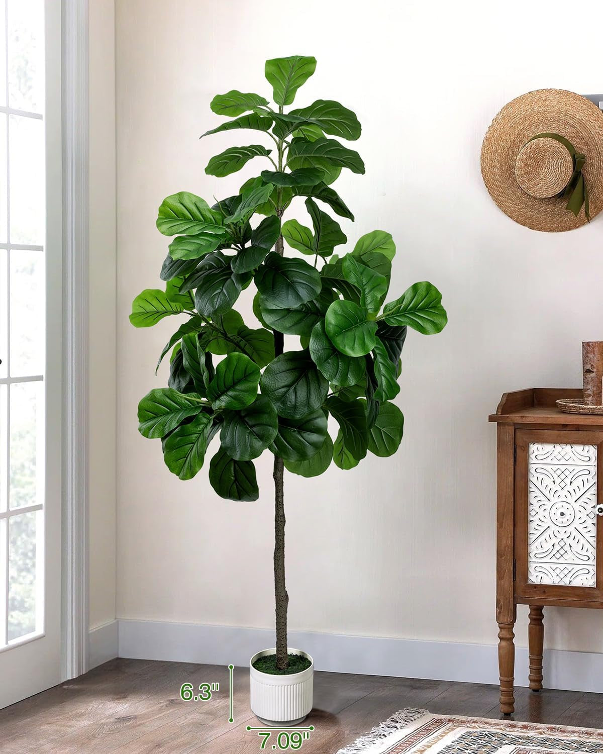 Fiddle leaf fig artificial tree styled in an entryway beside a wooden console, full height