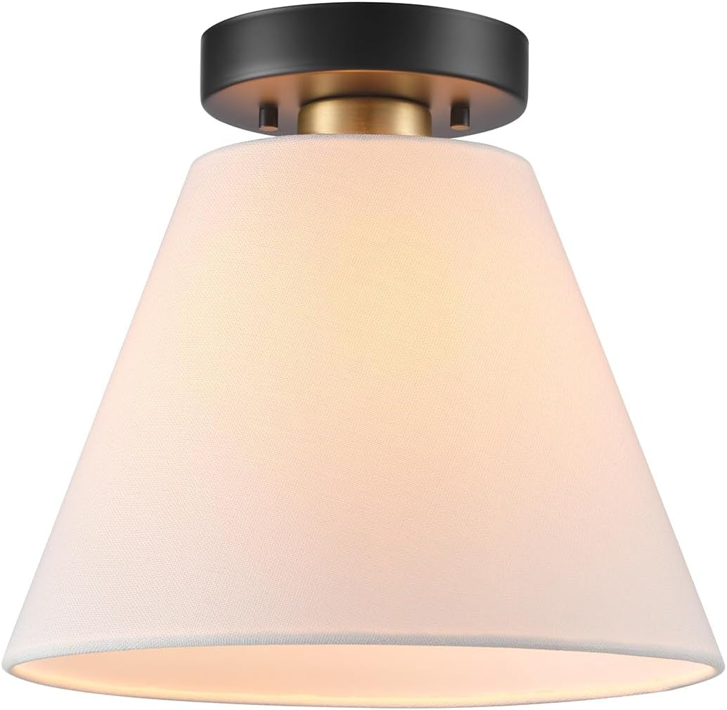 Front view of a single conical white linen shade hanging from a short dark canopy with a brass accent.