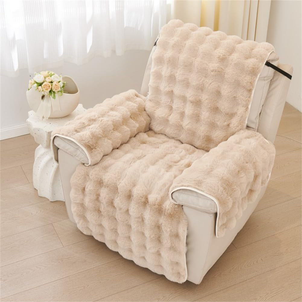 Beige faux fur slipcover on the same recliner, showing warm tone and plush tufted surface.