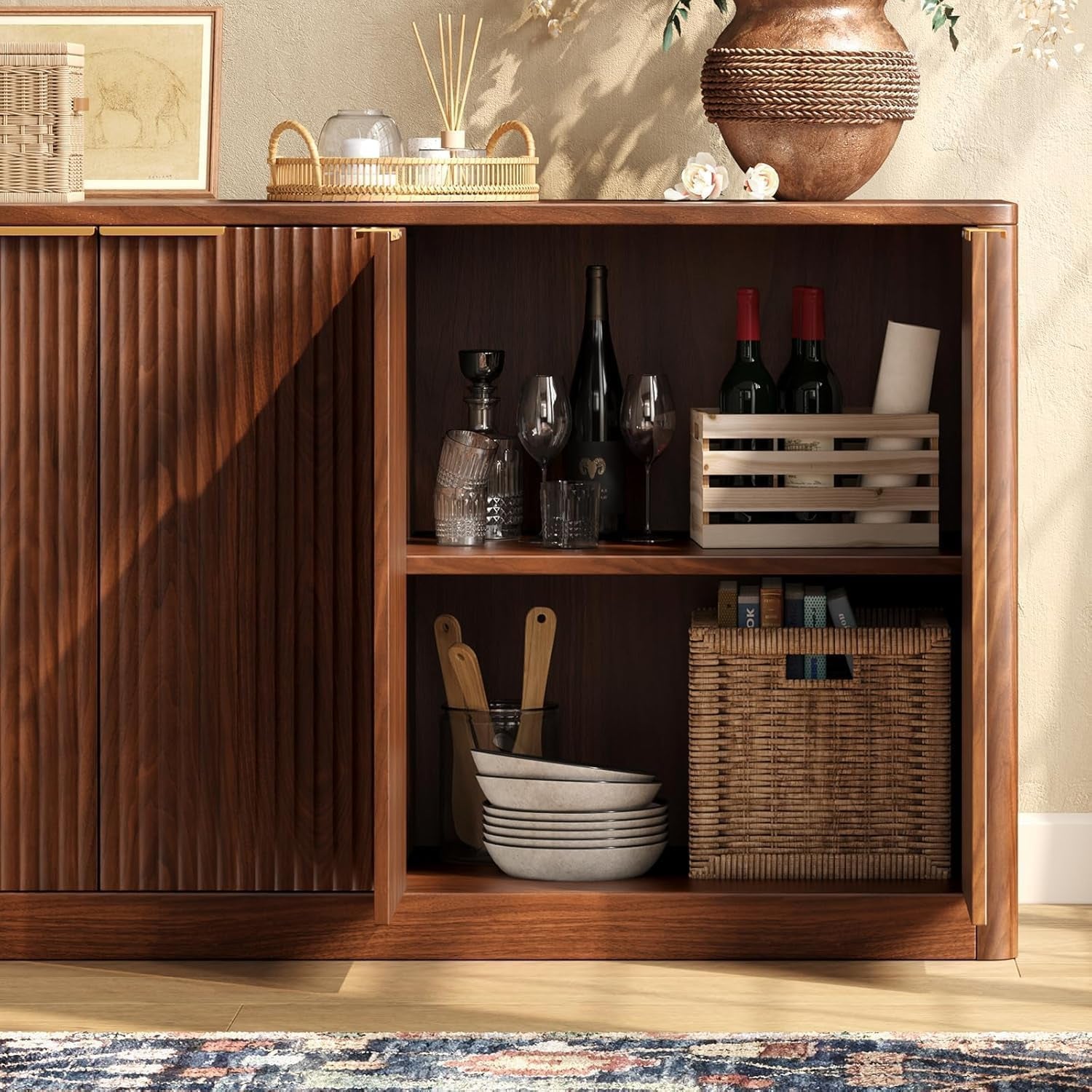 Open cabinet interior showing two shelves with dinnerware, wine bottles, and a woven basket
