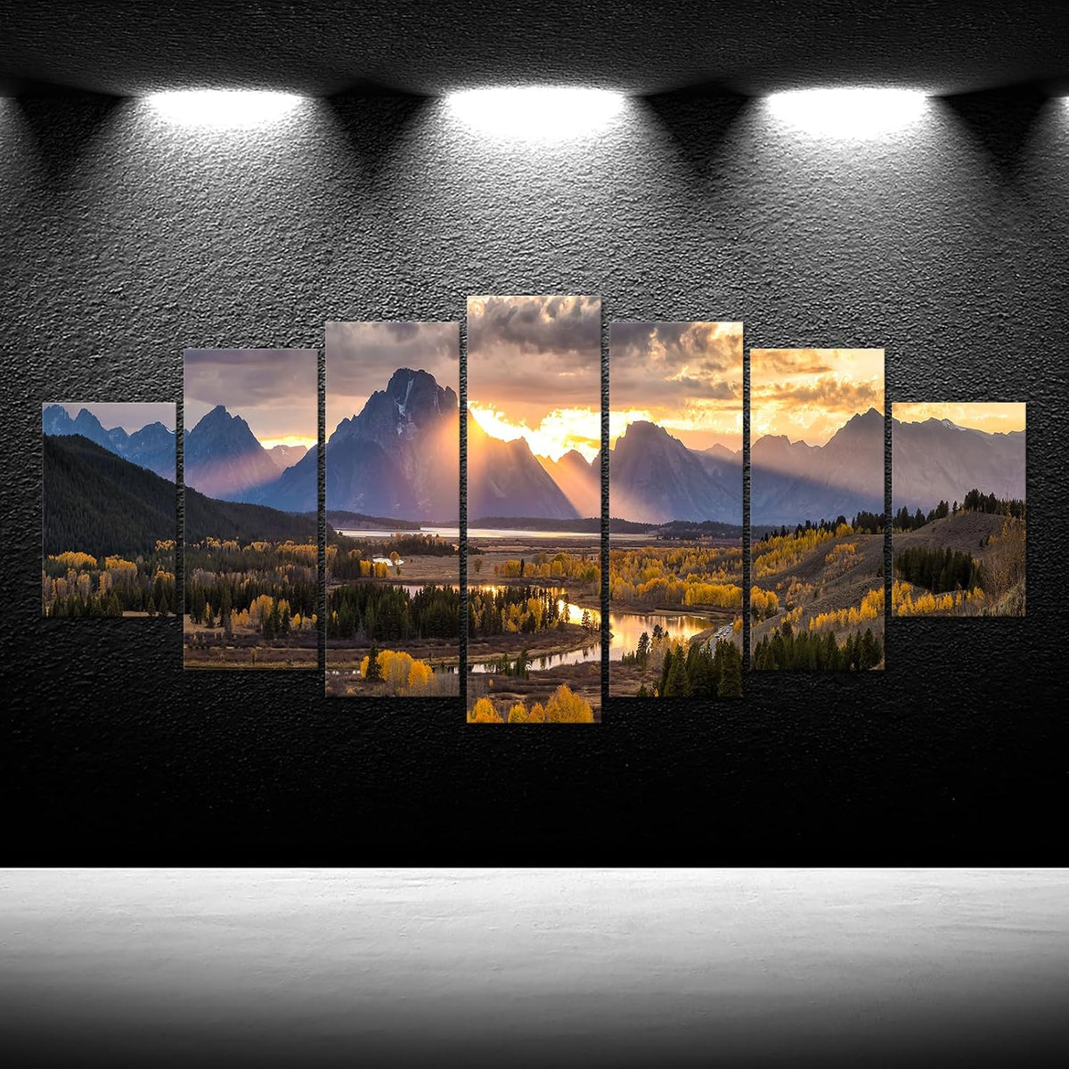 Seven-piece Grand Teton canvas set displayed on a black textured wall under spotlights, straight-on view