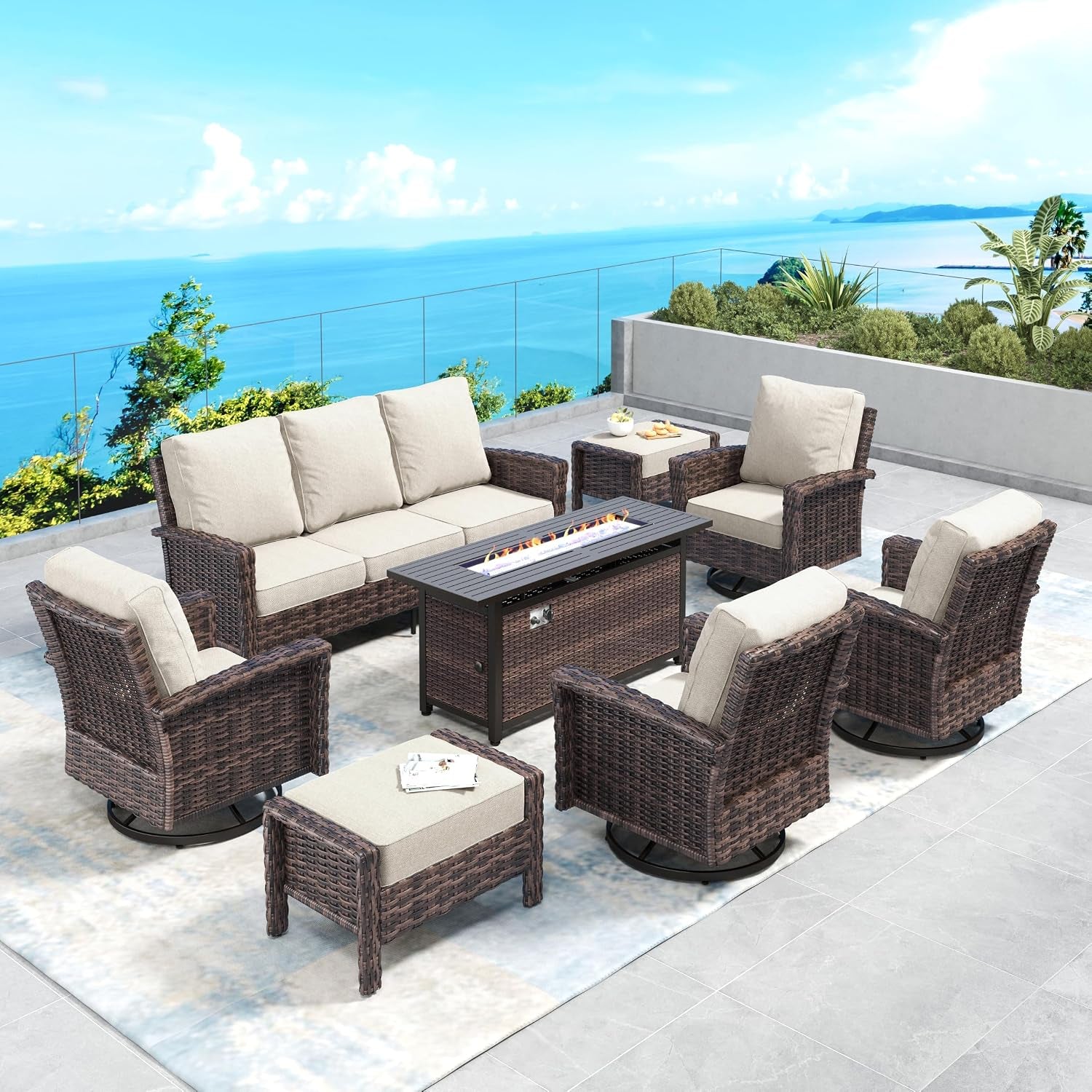 Five-piece wicker patio arrangement with beige cushions around a rectangular fire table on a terrace.