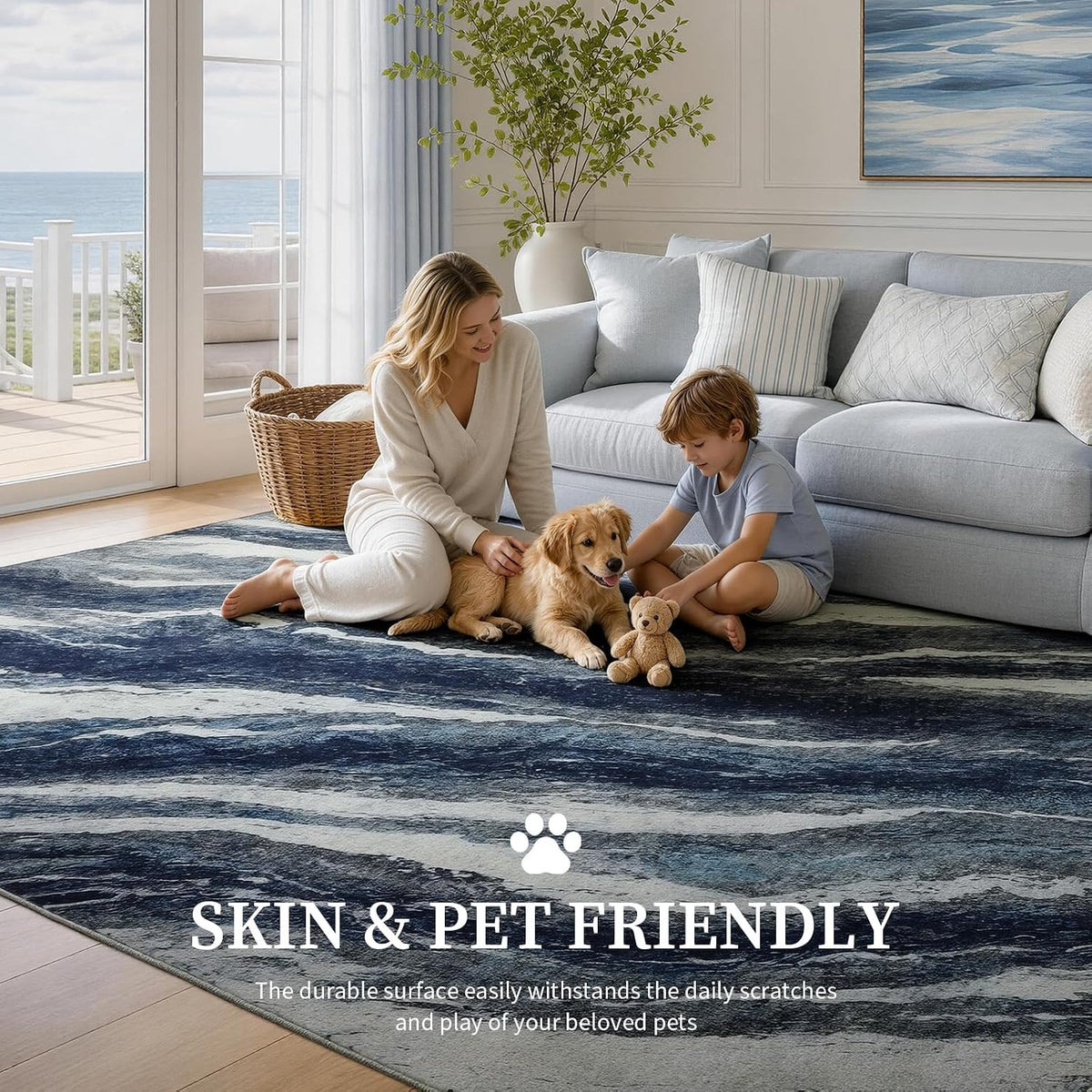 Blue and white abstract rug with child and dog playing on a low-pile surface in a bright coastal living room