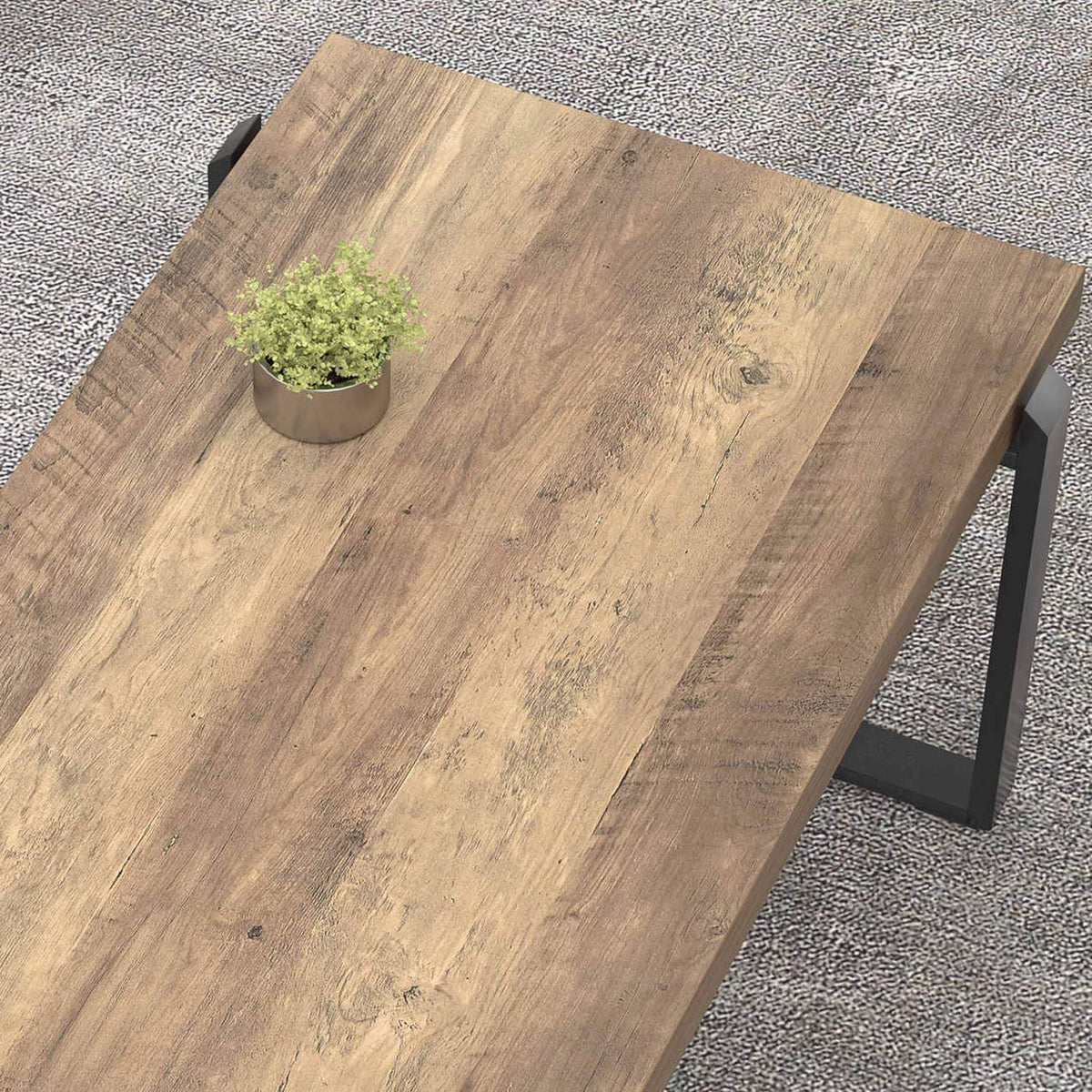 Close-up top view of rustic oak wood-grain tabletop showing plank texture and knots.