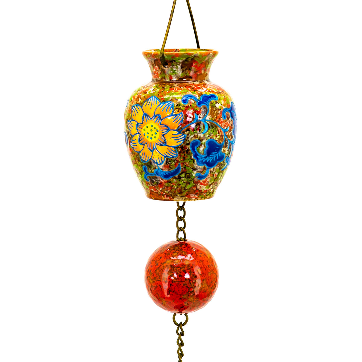 A patterned vase and red spherical bead are joined by short metal links in this close-up.