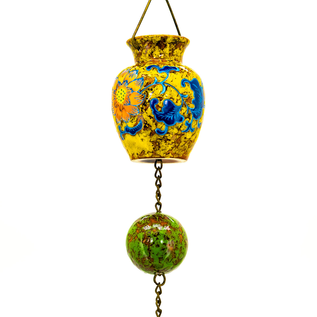 Close-up of a yellow floral porcelain vase linked by dark chain to a mottled green sphere.