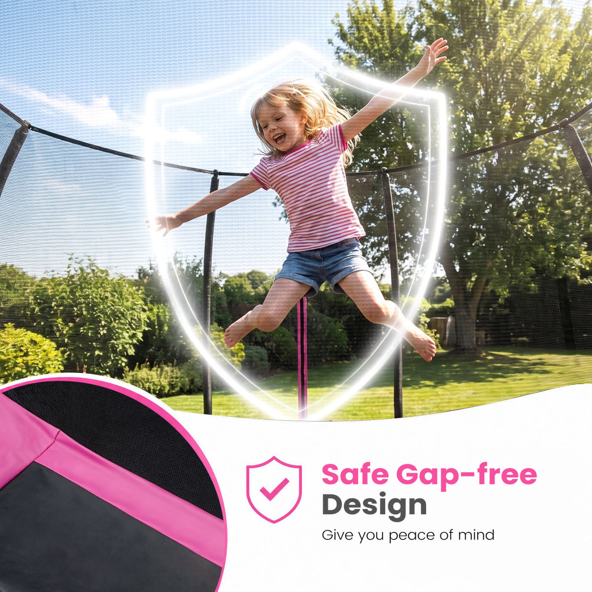 A child jumps inside a black mesh-enclosed trampoline on a sunny backyard lawn.