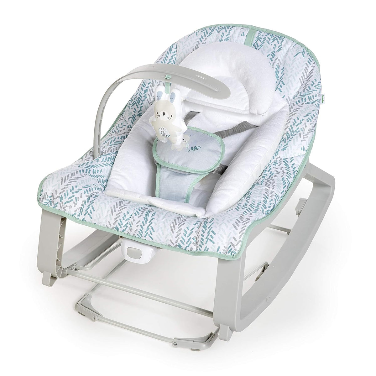 Three-quarter view of a mint and gray patterned baby bouncer with white insert and a hanging bunny toy.