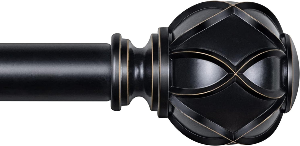Close-up of a single matte black curtain rod end with a carved spherical finial and gold trim