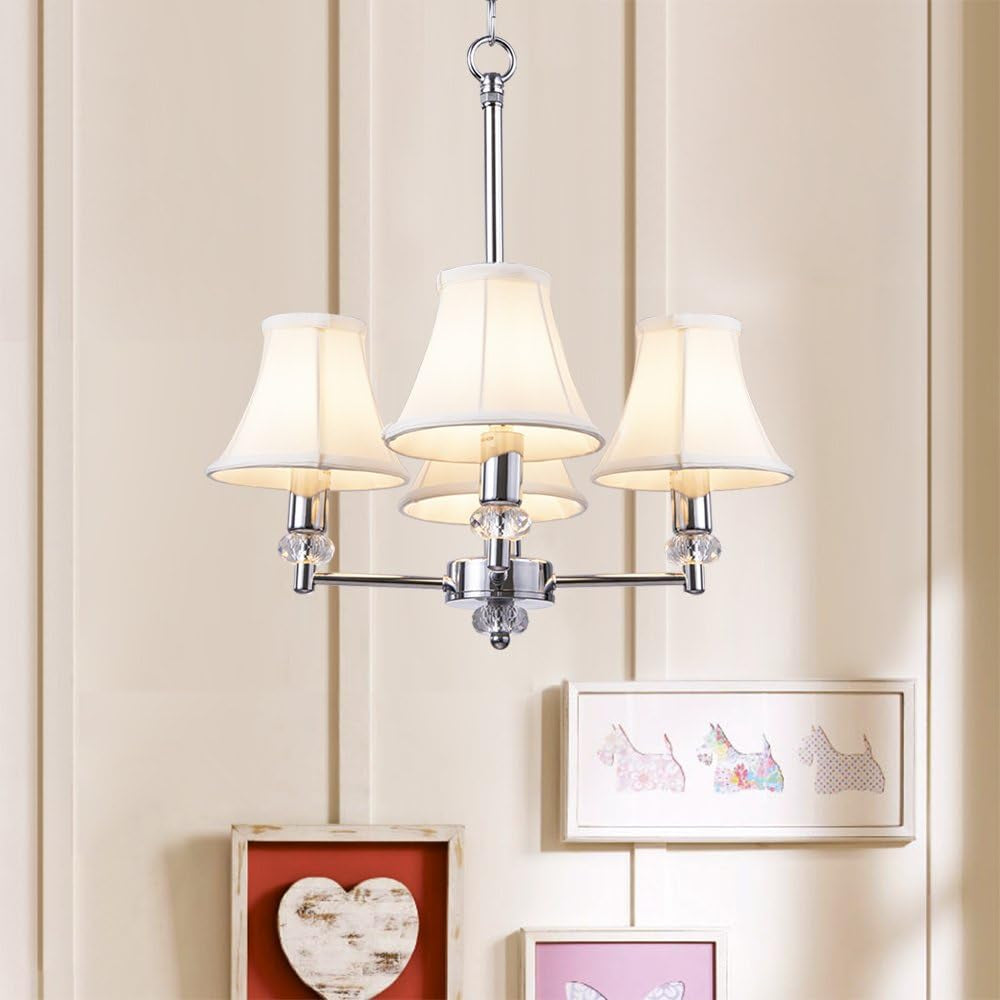 Three-light chrome chandelier with warm ivory shades hanging above framed artwork on a paneled wall