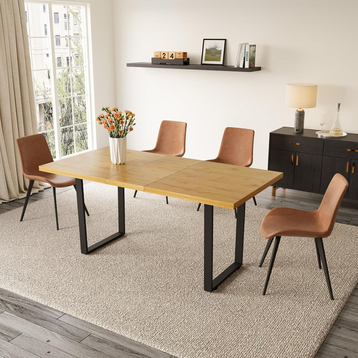 Light wood rectangular table with tan chairs arranged by a tall window in a sunlit dining corner.
