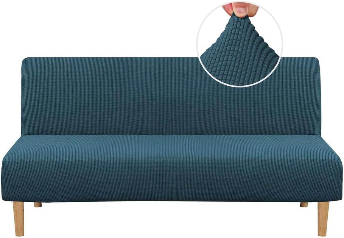 Front view of a teal small-check textured slipcover stretched over an armless futon with wood legs.